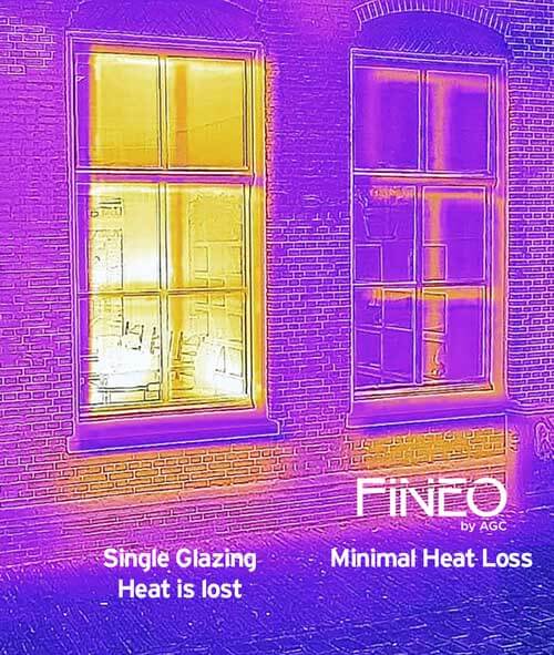 Thermal image comparing a single glazed window losing heat with a vacuum glazed window